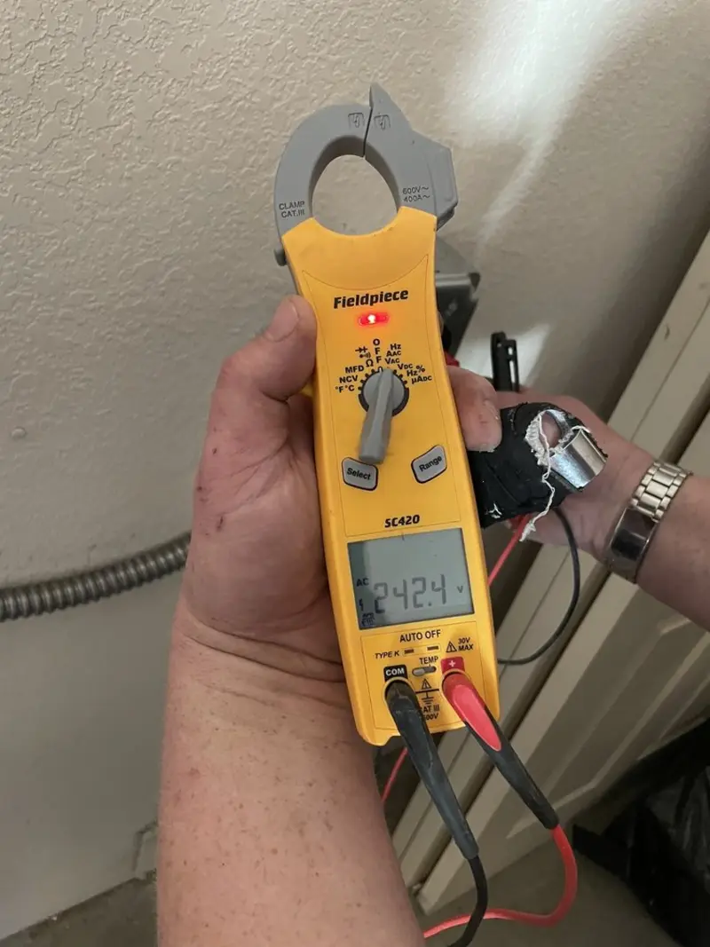 Voltage testing with clamp meter during Outlet Installation in Chippewa